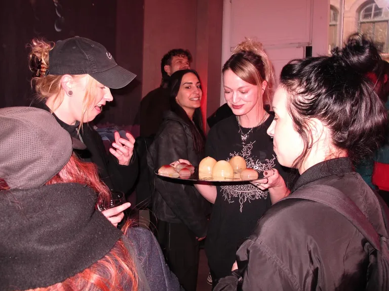 Vernissage of Pneuma with neon work and crowd